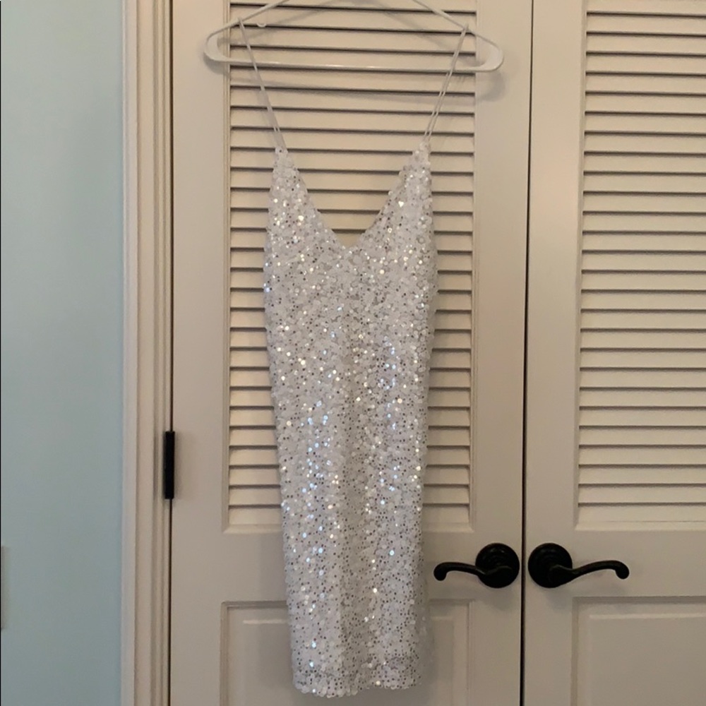 Sparkly white mini dress with open back